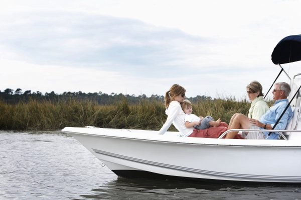 Family including boy (15-18 months) relaxing on boat in South Carolina