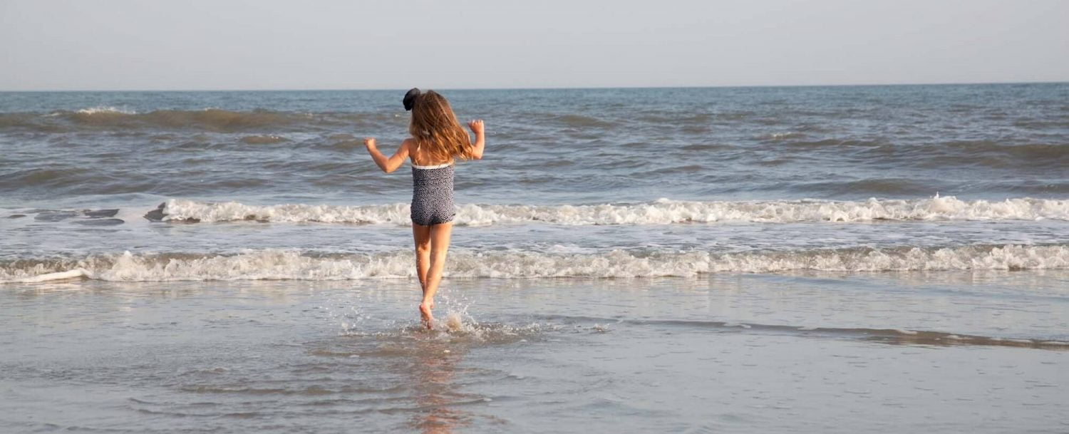 little girl on the beach family-friendly