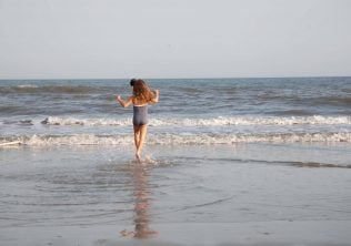 little girl on the beach family-friendly