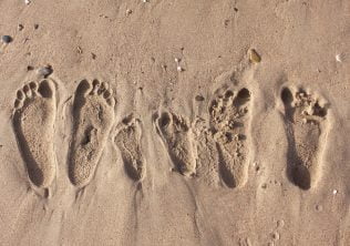 footprints in the sand from a charleston, sc, family vacation.