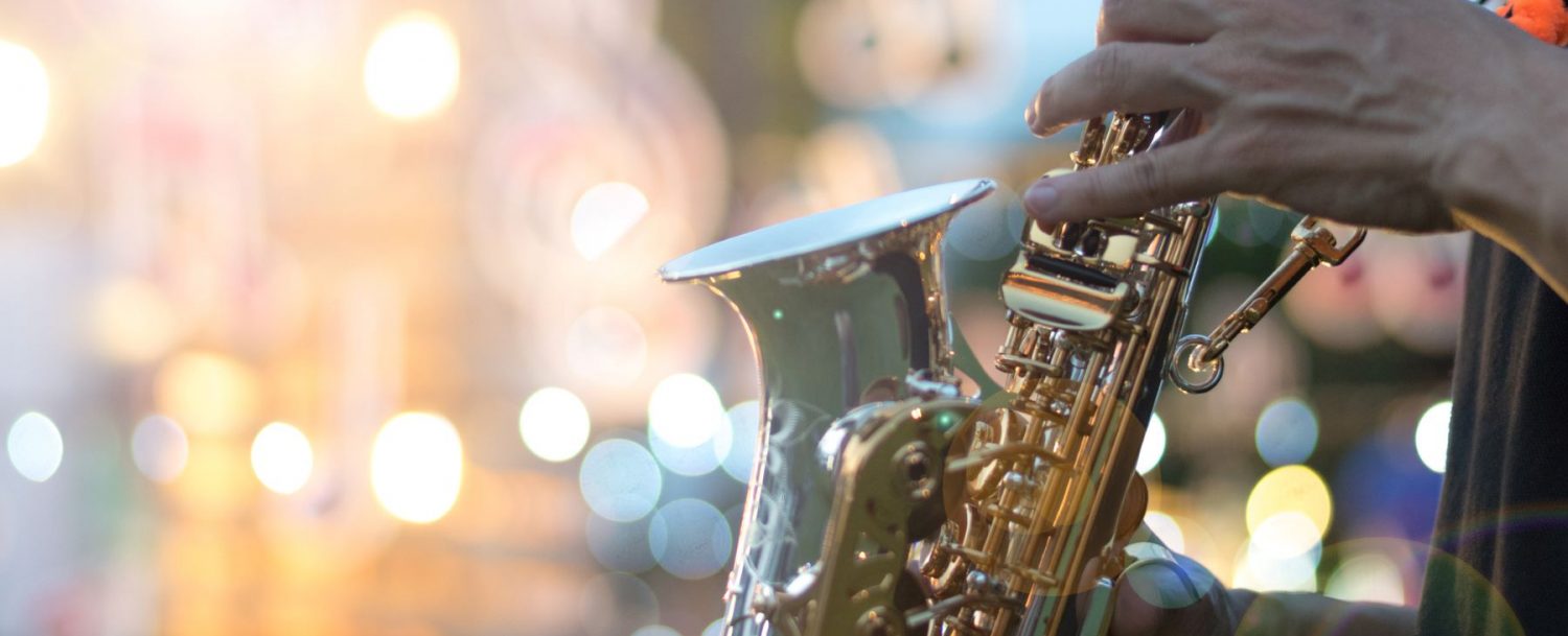 A musician playing the saxophone at the Kiawah Island Jazz Festival.