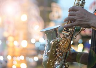 A musician playing the saxophone at the Kiawah Island Jazz Festival.