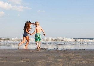 Family on beach near charleston